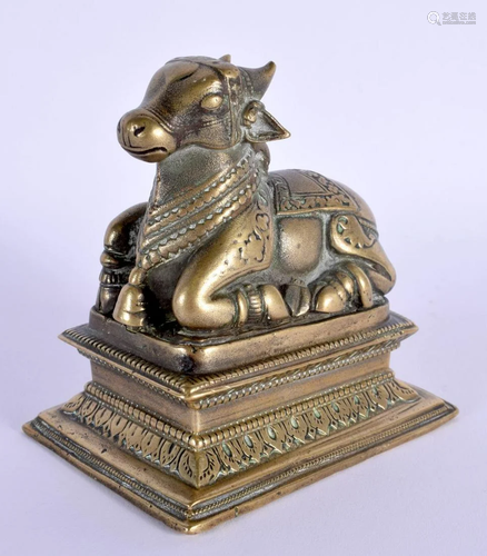 AN 18TH/19TH CENTURY INDIAN BRONZE FIGURE OF A SEATED BULL m...