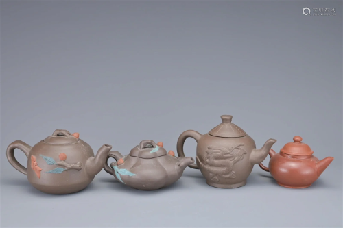 A GROUP OF FOUR CHINESE YIXING POTTERY TEAPOTS
