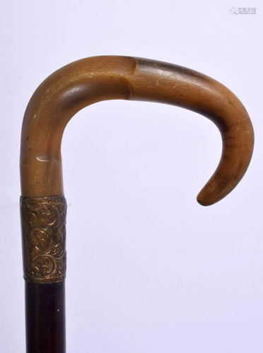 A 19TH CENTURY MIDDLE EASTERN CARVED RHINOCEROS HORN WALKING...