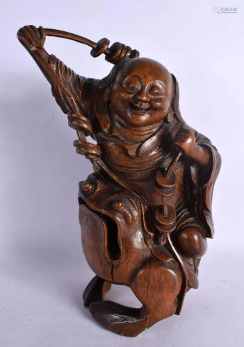 A LATE 18TH/19TH CENTURY CHINESE CARVED BAMBOO FIGURE OF A L...