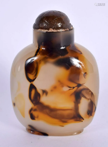 A CHINESE QING DYNASTY CARVED AGATE SNUFF BOTTLE AND STOPPER...