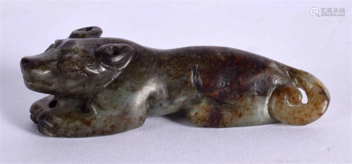 AN 18TH CENTURY CHINESE MUTTON JADE FIGURE OF A RECUMBANT BE...