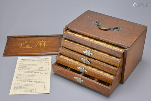 A CHINESE WOODEN CASED MAHJONG SET, EARLY 20TH CENTURY