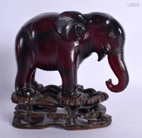 A RARE 19TH CENTURY CHINESE CARVED CHERRY RED AMBER ELEPHANT...