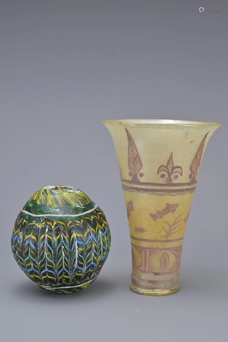 A MARBLED GLASS BEAD AND ISLAMIC CUP