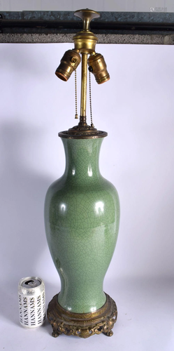 A LARGE 19TH CENTURY CHINESE CRACKLE GLAZED CELADON LAMP upo...