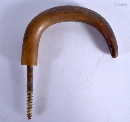 A 19TH CENTURY MIDDLE EASTERN CARVED RHINOCEROS HORN HANDLE....