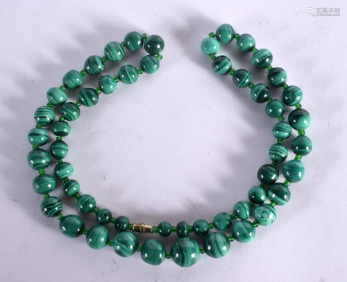 A CHINESE CARVED MALACHITE NECKLACE 20th Century. 120 grams....