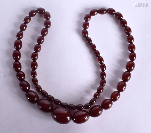 CHERRY AMBER TYPE NECKLACE. Largest bead 20.9mm^ weight 65g