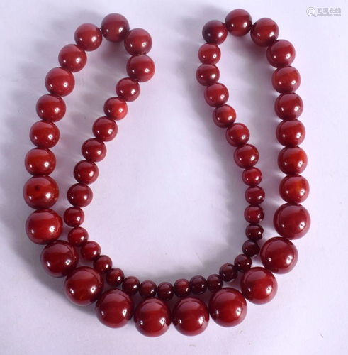 CHERRY AMBER TYPE NECKLACE. Length 94cm^ weight 205g