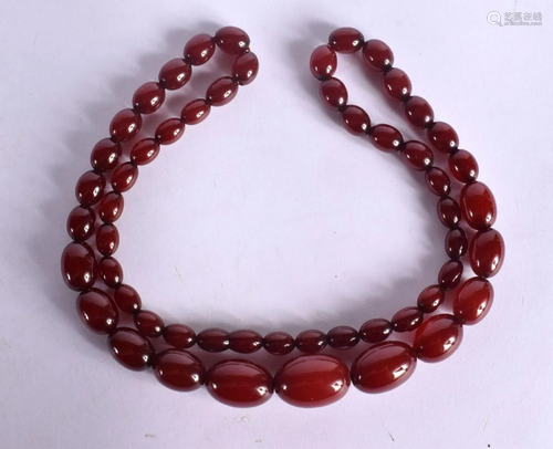 A FINE ART DECO CHERRY AMBER NECKLACE. 50 grams. 68 cm long^...