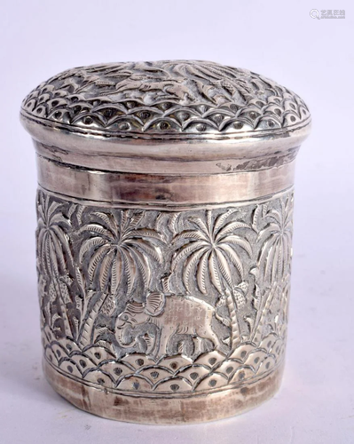 AN INDIAN WHITE METAL BOX AND COVER decorated with elephants...