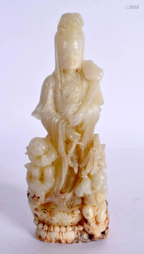 A CHINESE CARVED GREENISH WHITE JADE BUDDHISTIC FIGURE 20th ...