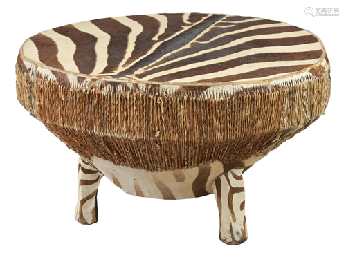 AN AFRICAN ZEBRA-HIDE DRUM-TABLE, 20TH CENTURY