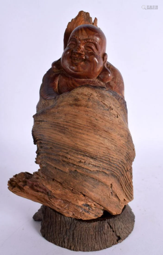 A CHINESE CARVED HARDWOOD FIGURE OF A BUDDHA 20th Century. 2...