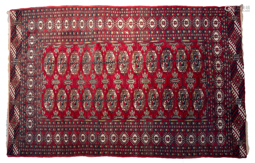 A MIDDLE EASTERN PERSIAN BOKHARA WOOL RUG