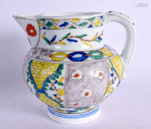 A TURKISH MIDDLE EASTERN FAIENCE KUTAHYA PORCELAIN JUG. 11 c...