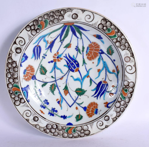 A TURKISH MIDDLE EASTERN FAIENCE IZNIK PLATE painted with fo...