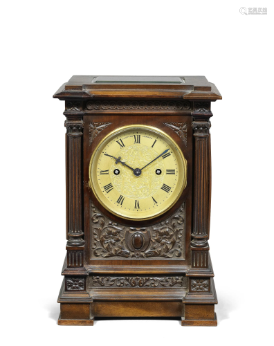 A fine early 20th century carved mahogany table clock, dated...