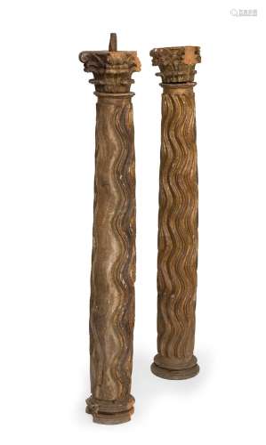 Pair of columns. Spain, 17th century. Carved wood, traces of...
