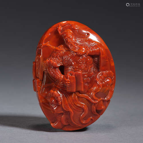 A red agate carving of god of wealth