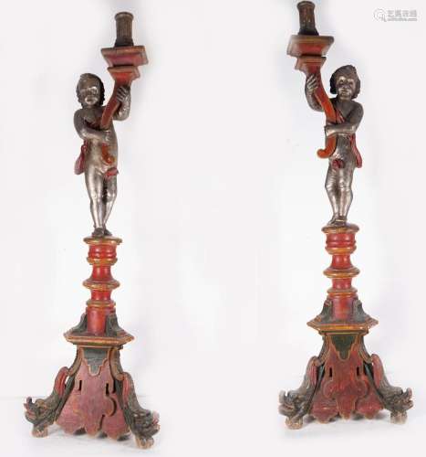 PAIR OF LARGE TORCH HOLDERS TOPPED WITH ANGELS IN POLYCHROME...