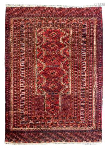 An Afghan Turkman Prayer Rug, the scarlet ground with centra...