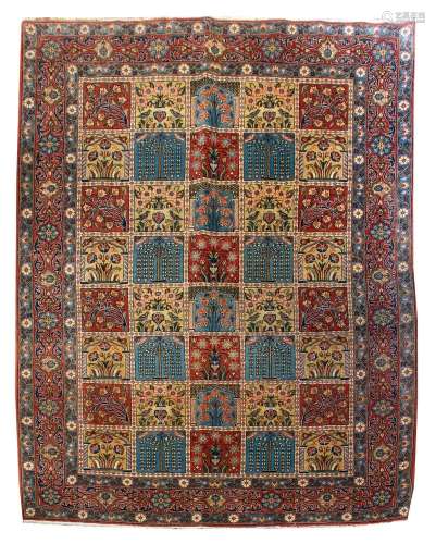 A Ghom Rug, with multiple foliate panels within a floral mea...