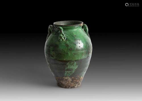 A RARE FATIMID GREEN GLAZED POTTERY VASE WITH HANDLES, EGYPT...