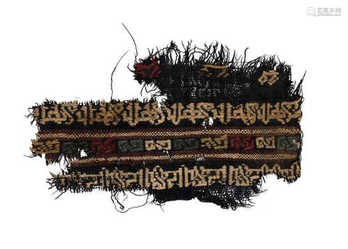 A FATIMID SILK TEXTILE FRAGMENT WITH CALLIGRAPHY