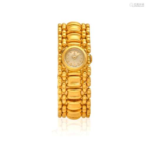 OMEGA. A LADY'S 18K GOLD MANUAL WIND BRACELET WATCH Post Ret...