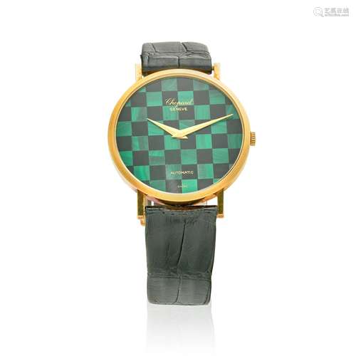 CHOPARD. AN 18K GOLD MALACHITE AND ONYX AUTOMATIC WRISTWATCH...