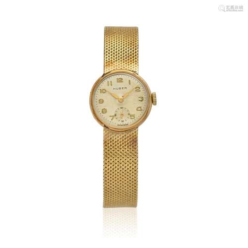 HUBER. A LADY'S 14K GOLD MANUAL WIND BRACELET WATCH