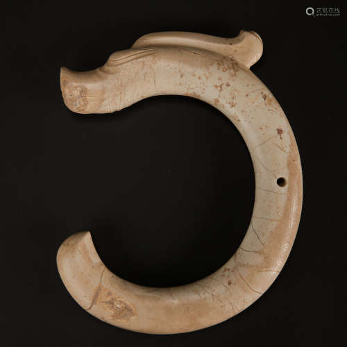 CHICKEN BONE WHITE JADE C-SHAPED DRAGON FROM HONGSHAN PERIOD...