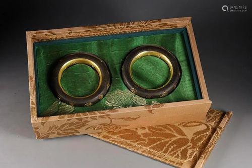 TWO CHINESE GILT-BRONZE-INLAID AGARWOOD BANGLES DEPICTING &#...