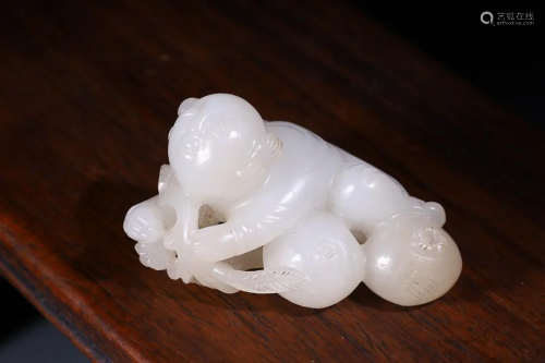 CHINESE HETIAN JADE FIGURE OF BOY AND POMEGRANATE