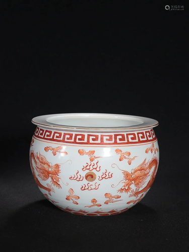 CHINESE IRON-RED CROCK DEPICTING 'DRAGON PURSUING PEARL...