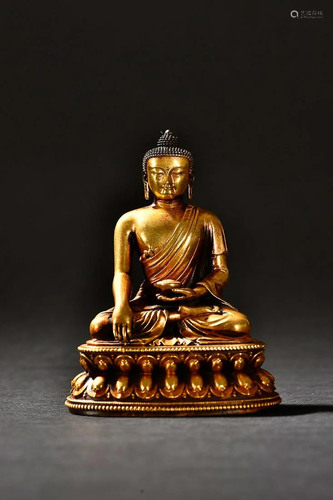 CHINESE GILT-BRONZE FIGURE OF SAKYAMUNI