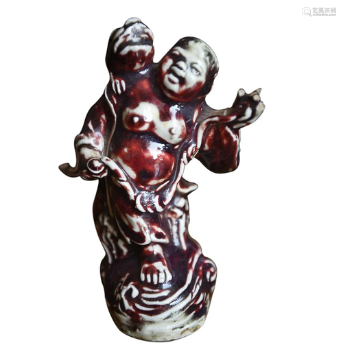 CHINESE RED-GLAZED FIGURE OF LIUHAI