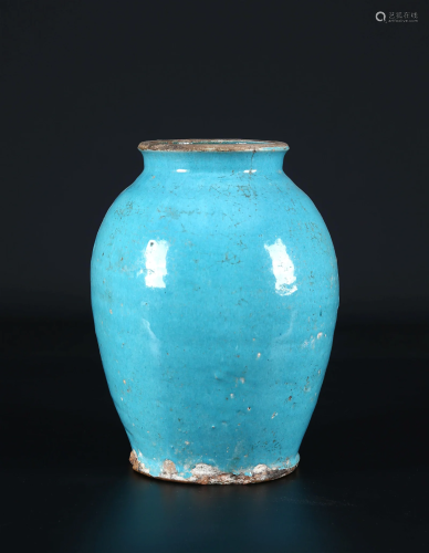 A Seljuk Turquoise Glazed Pottery Vase.