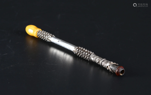 A Silver Cigarette Holder with Amber Mouthpiece