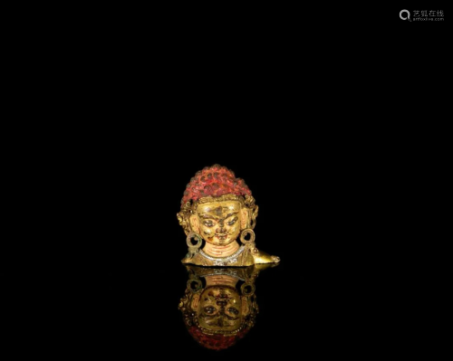 A gilt bronze head of Mahakala
