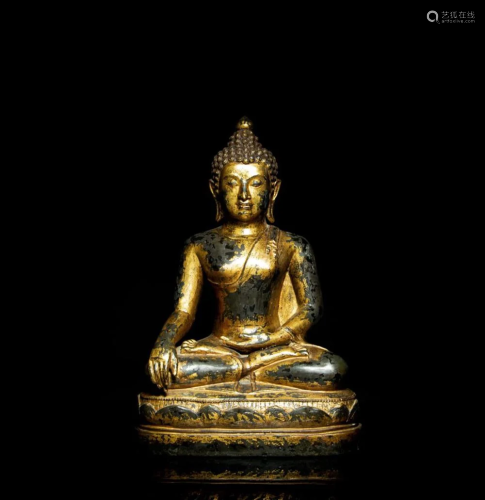 A gilt and lacquered bronze seated figure of Buddha