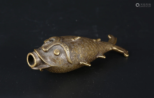 An Indian brass powder flask in the form of a fish.