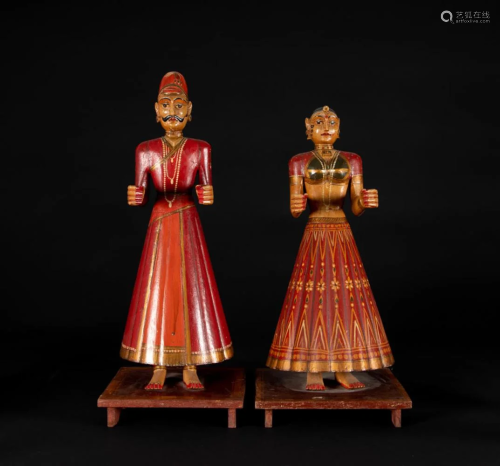 A pair of North Indian carved and painted wood figures