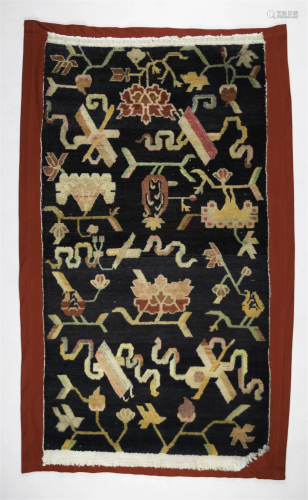 A Tibetan Rug with Buddhist Symbols Himalayan States