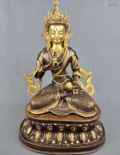 Vajrasatva, seated Buddha figure of Vajrasatva, holding a va...