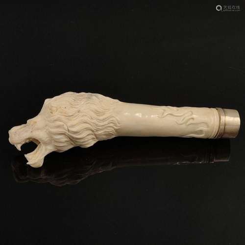 Bone carving, as a fully sculptured lion s head with opened ...