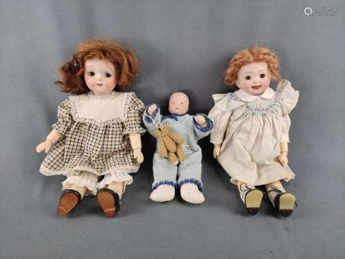 Three porcelain dolls, once Armand Marseille doll in plaid d...