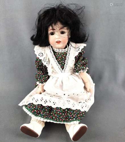 Doll by J. D. Kestner, with brown glass eyes and opened mout...